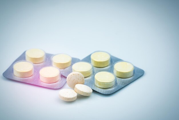 Close-up of medicines over white background