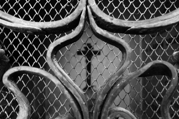 Close-up of metal grate in cemetery