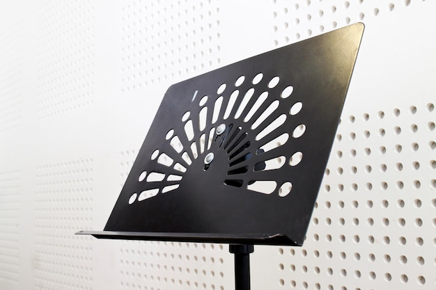 Close-up of metallic music sheet stand