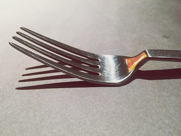 Photo close-up of metallic object over white background