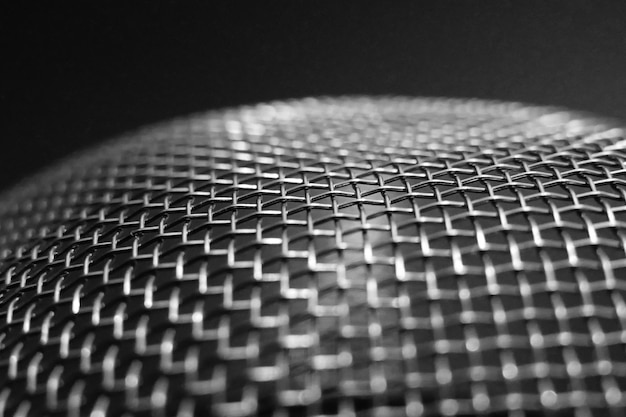 close-up of metallic structure against black background