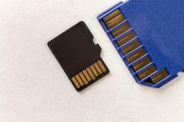 Close-up of micro SD memory card and SD adapter