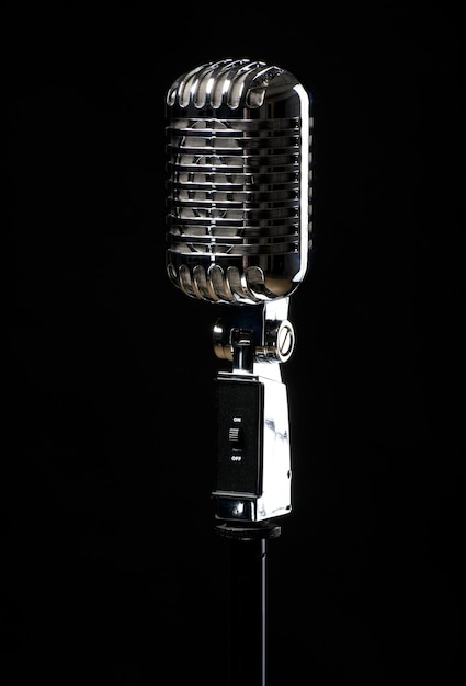 Photo close-up of microphone against black background