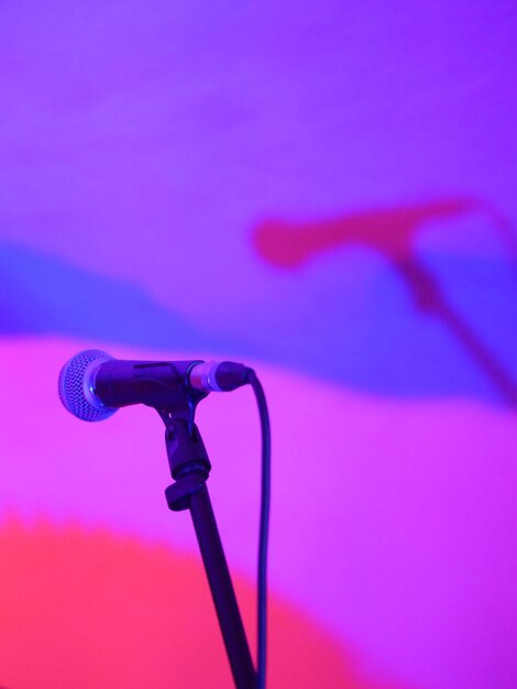 Close-up of microphone against wall