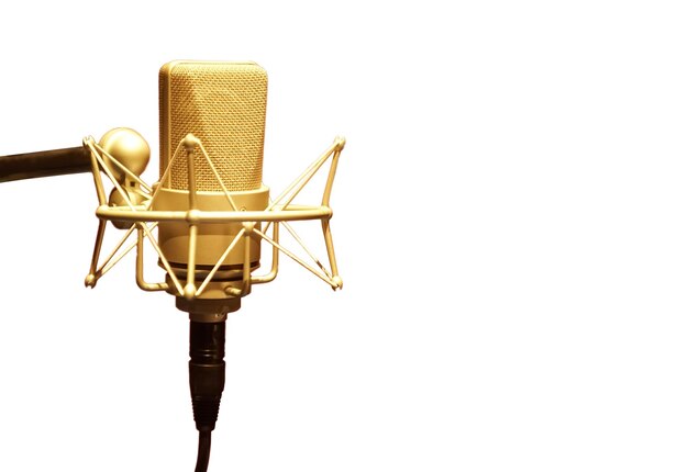 Photo close-up of microphone against white background