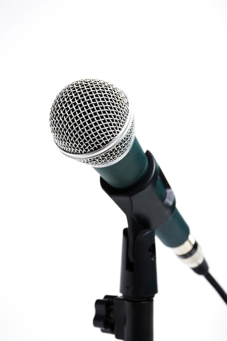 Photo close-up of microphone against white background