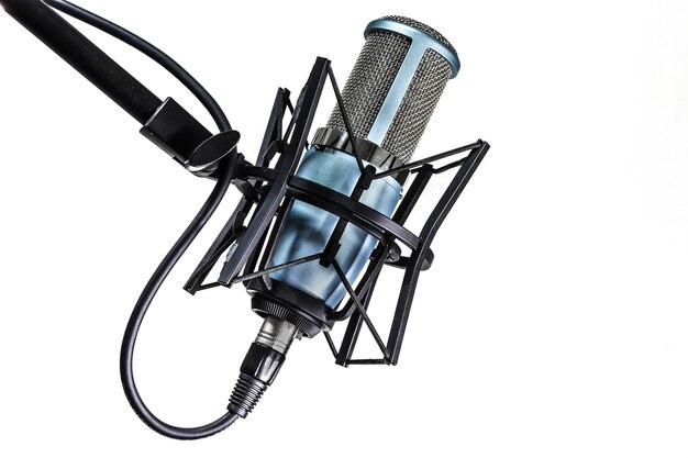 Photo close-up of microphone against white background