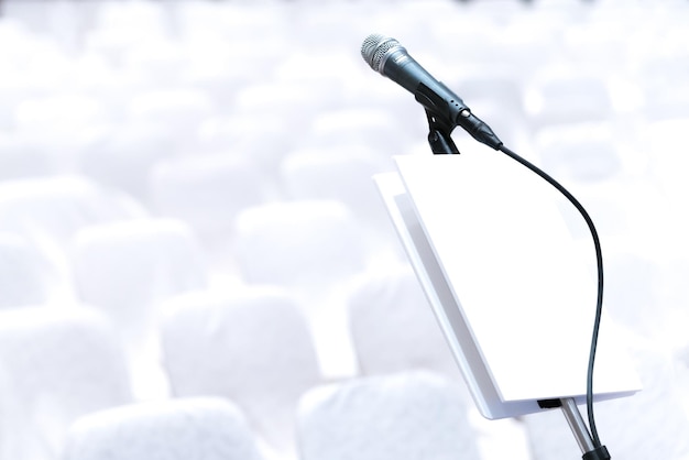 Photo close up of microphone in auditorium