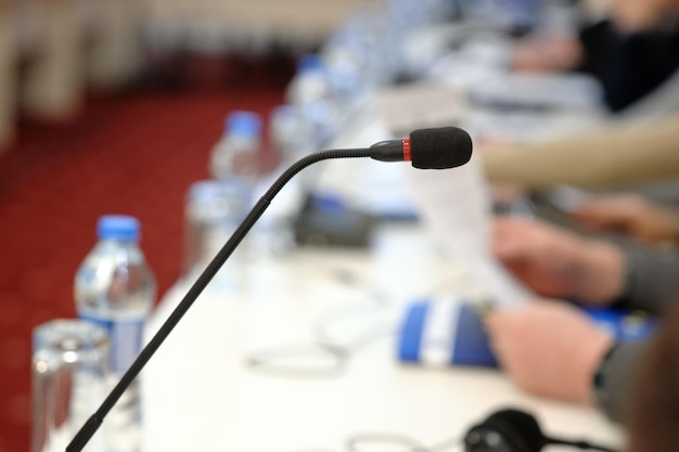 Photo close-up of microphone in auditorium