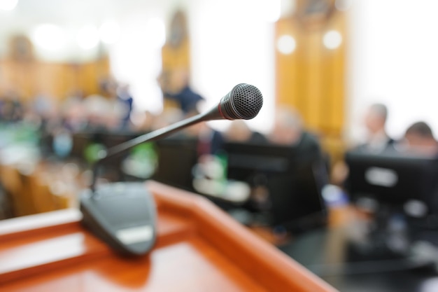 Photo close-up of microphone in auditorium