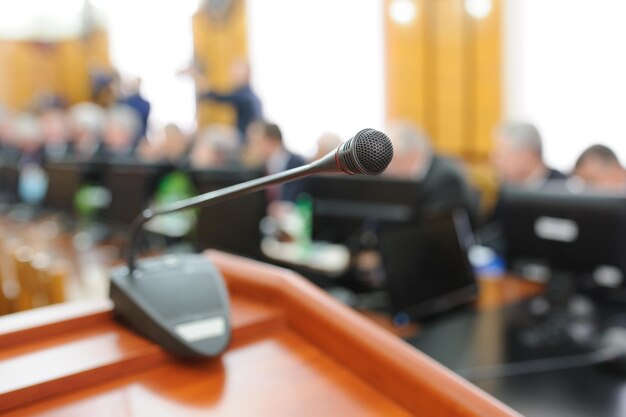 Photo close-up of microphone in auditorium