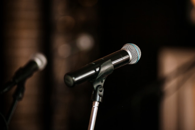 Close up of microphone in concert hall or conference room