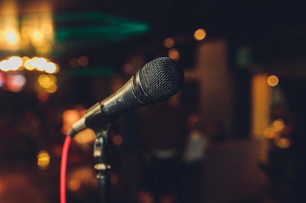 Close up of microphone in concert hall or conference room.