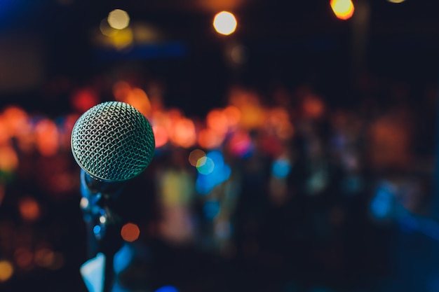 Close up of microphone in concert hall or conference room.