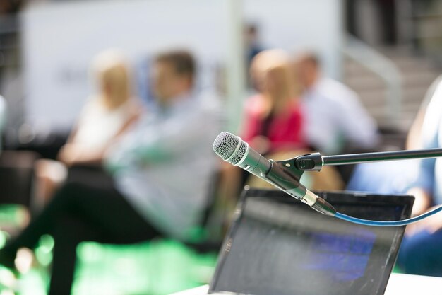 Photo close-up of microphone at seminar outdoors