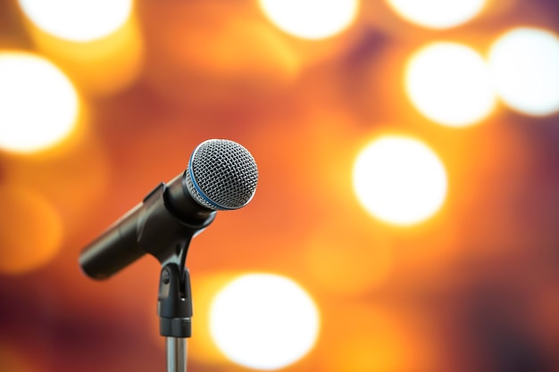Close-up the microphone on stand with blur background