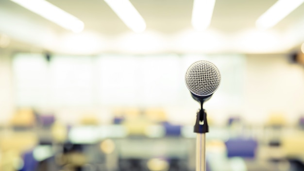 Close-up the microphone on stand with blur background.