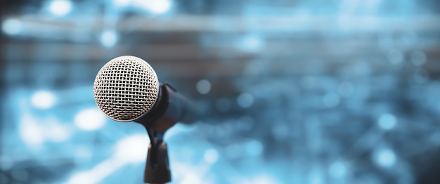 Close-up the microphone on stand with blur background.