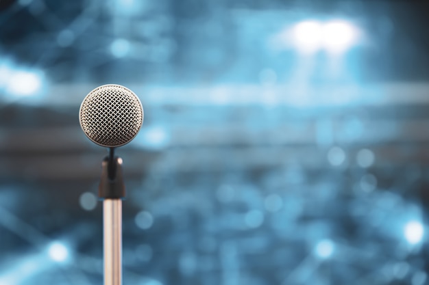 Close-up the microphone on stand with blur background.