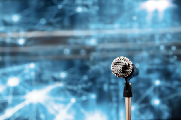 Close-up the microphone on stand with blur background.