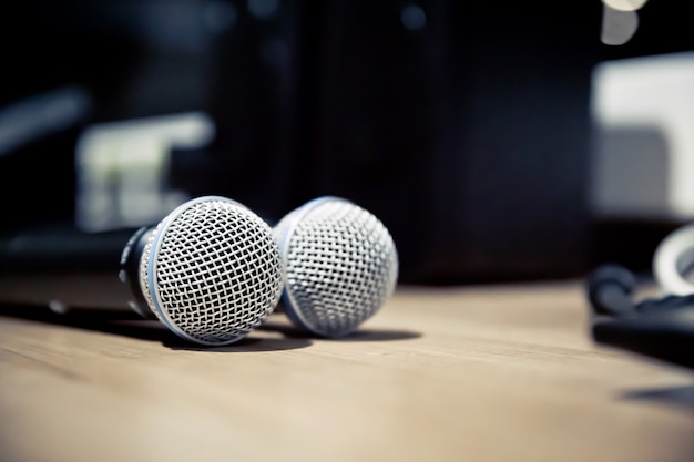 Close-up microphone with laptop in the studio.