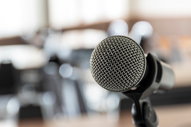 Close up microphone with tripod on stage in seminar room