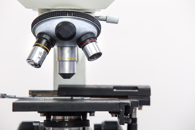 Photo close-up of microscope against white background