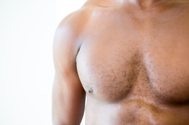 Photo close-up mid section of shirtless muscular man