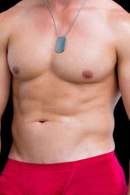 Photo close-up mid section of a shirtless muscular man