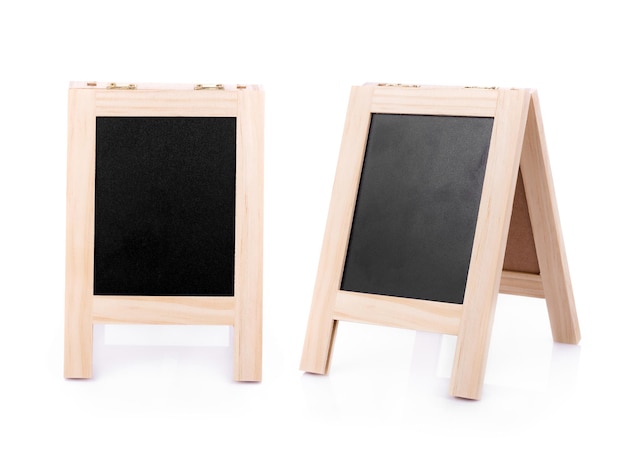 Photo close-up of miniature blackboards against white background