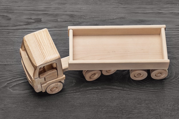 Close-up of a miniature wooden toy truck