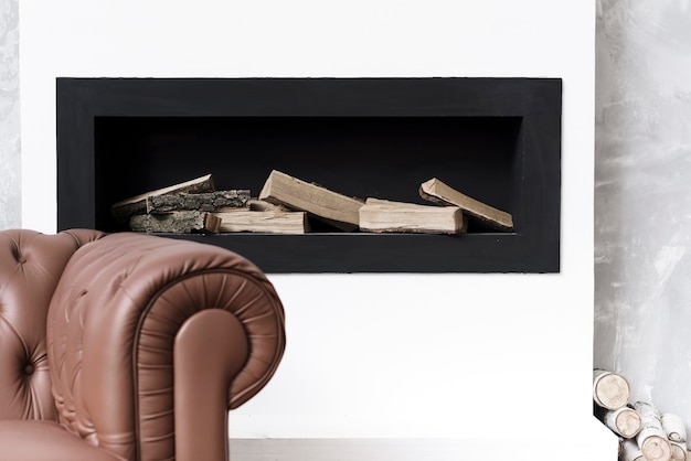 Photo close-up minimalist fireplace  and sofa