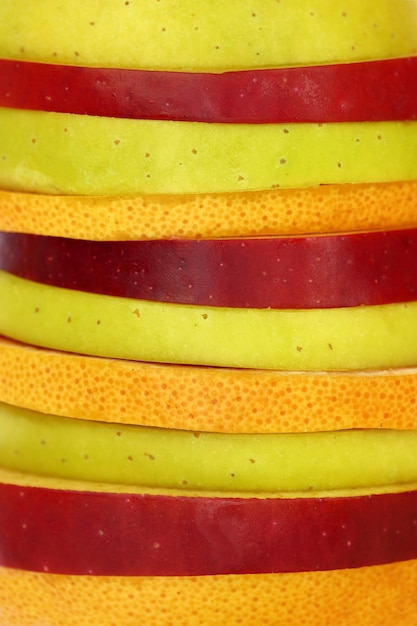 Close up of mixed slices of fruit in a row