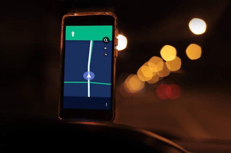 Photo close-up of mobile phone navigation in car