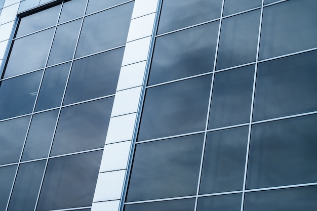 Close-up of a modern glass building with square blue glass