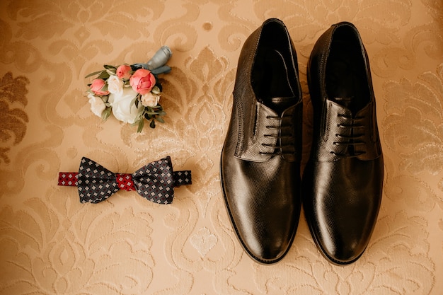 Close up of modern groom accessories