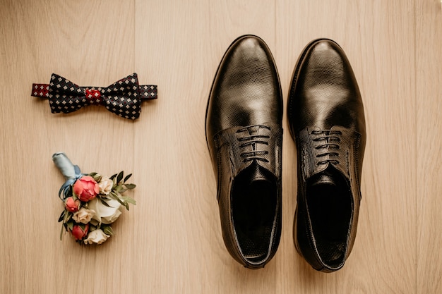 Close up of modern groom accessories