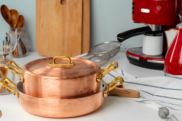 Close up of modern kitchen interior with copper cookware