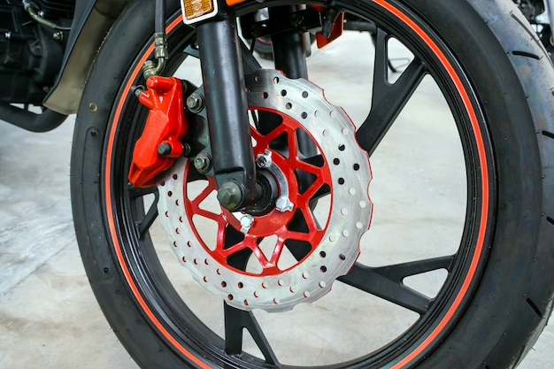 Close up of modern red motorbike brake background