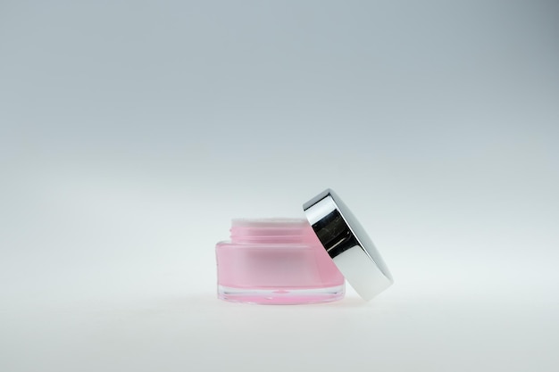 Close-up of moisturizer in bottle against white background