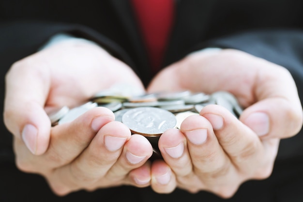 Close up money coins in hands