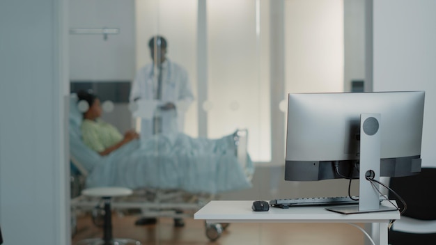 Close up of monitor on desk in empty office at medical clinic