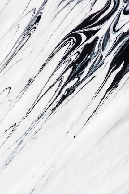 Photo close-up of monochrome paint swirls