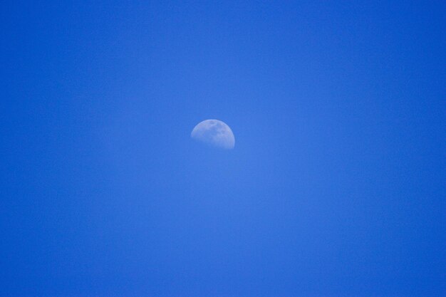 Close-up of moon against blue sky