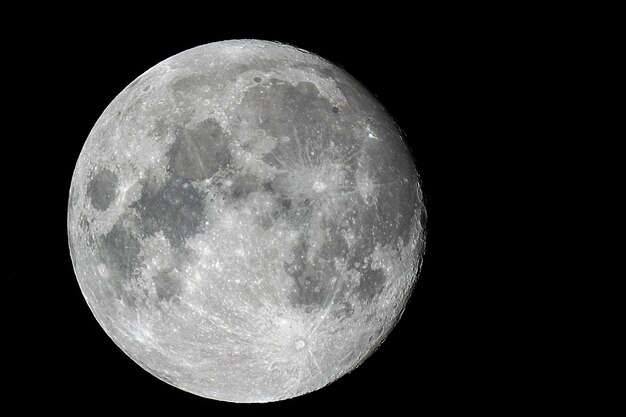 Photo close-up of moon against clear sky at night