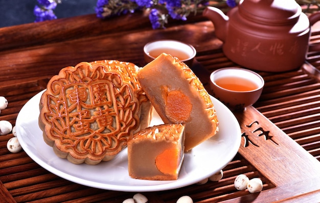 Close up moon cakes with black background Mooncake is a traditional Chinese bakery Often eating on MidAutumn Festival or lunar appreciation festival