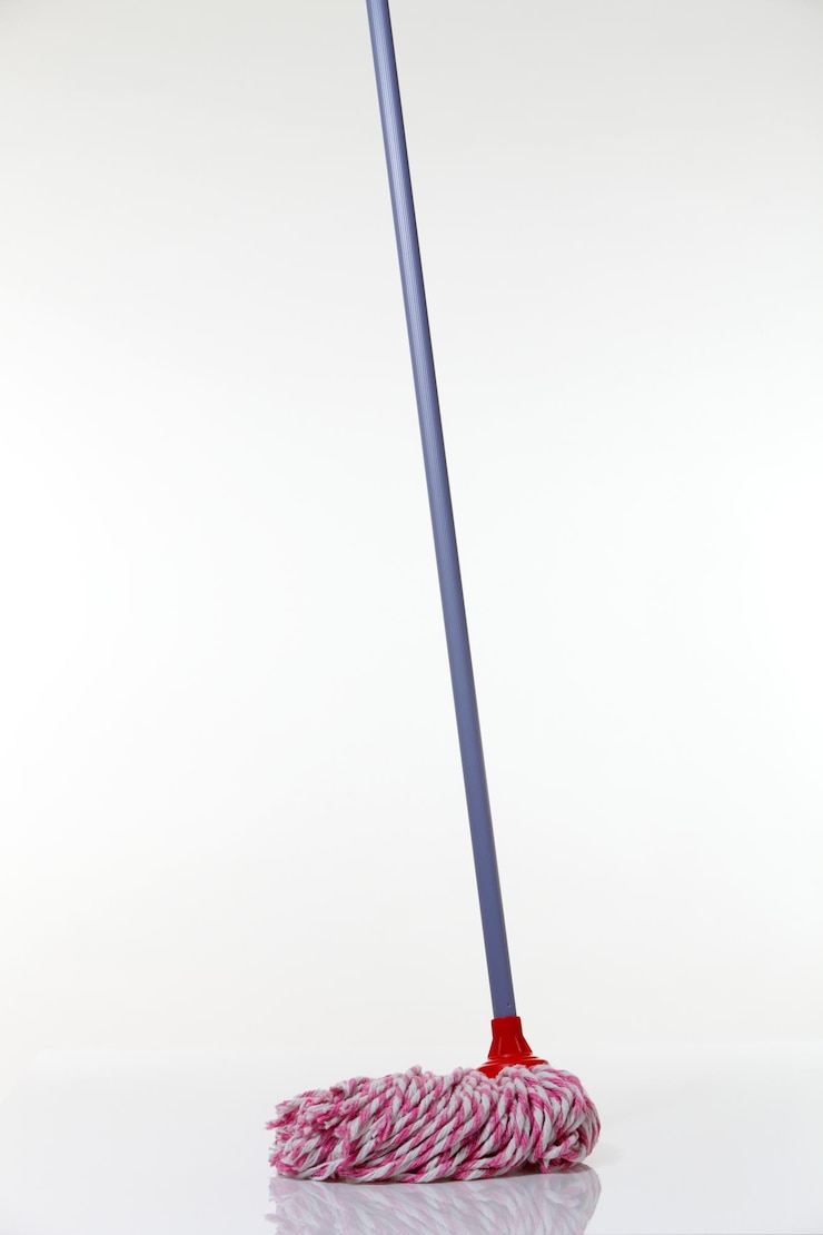 Photo close-up of mop against white background