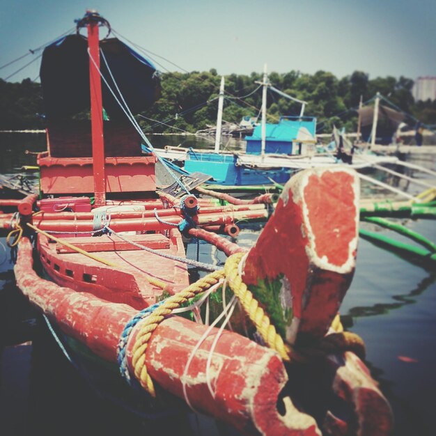 Close-up of motorboats moored at dock