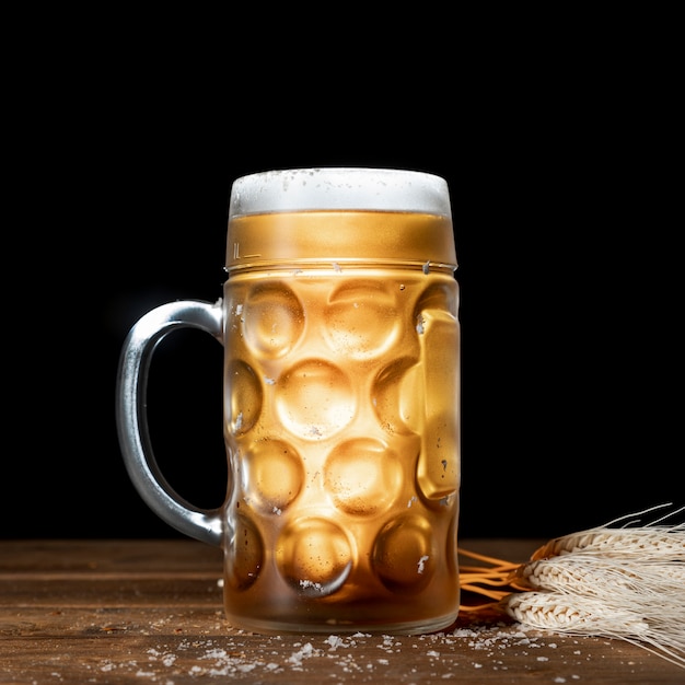 Close-up mug of beer with black background