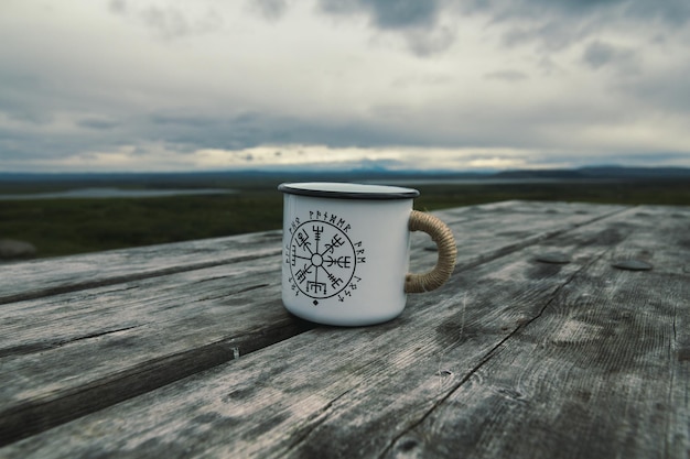 Close up mug on wooden table concept photo
